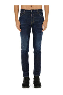 Back side of dark blue slim fit denim jeans with subtle fading and dsquared2 logo on the waistband