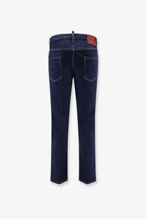 Dsquared2 men’s cool guy jeans in dark blue denim with white stitching and a brown leather brand patch at the waistband