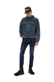 Dark blue distressed dsquared2 hoodie with faded logo and embroidered emblem shown with mens cool guy jeans blue