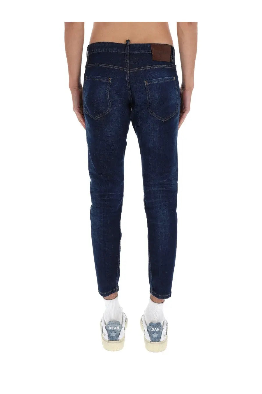 Dark blue slim fit cotton denim jeans with subtle fading and brown leather patch on waistband by Dsquared2 men