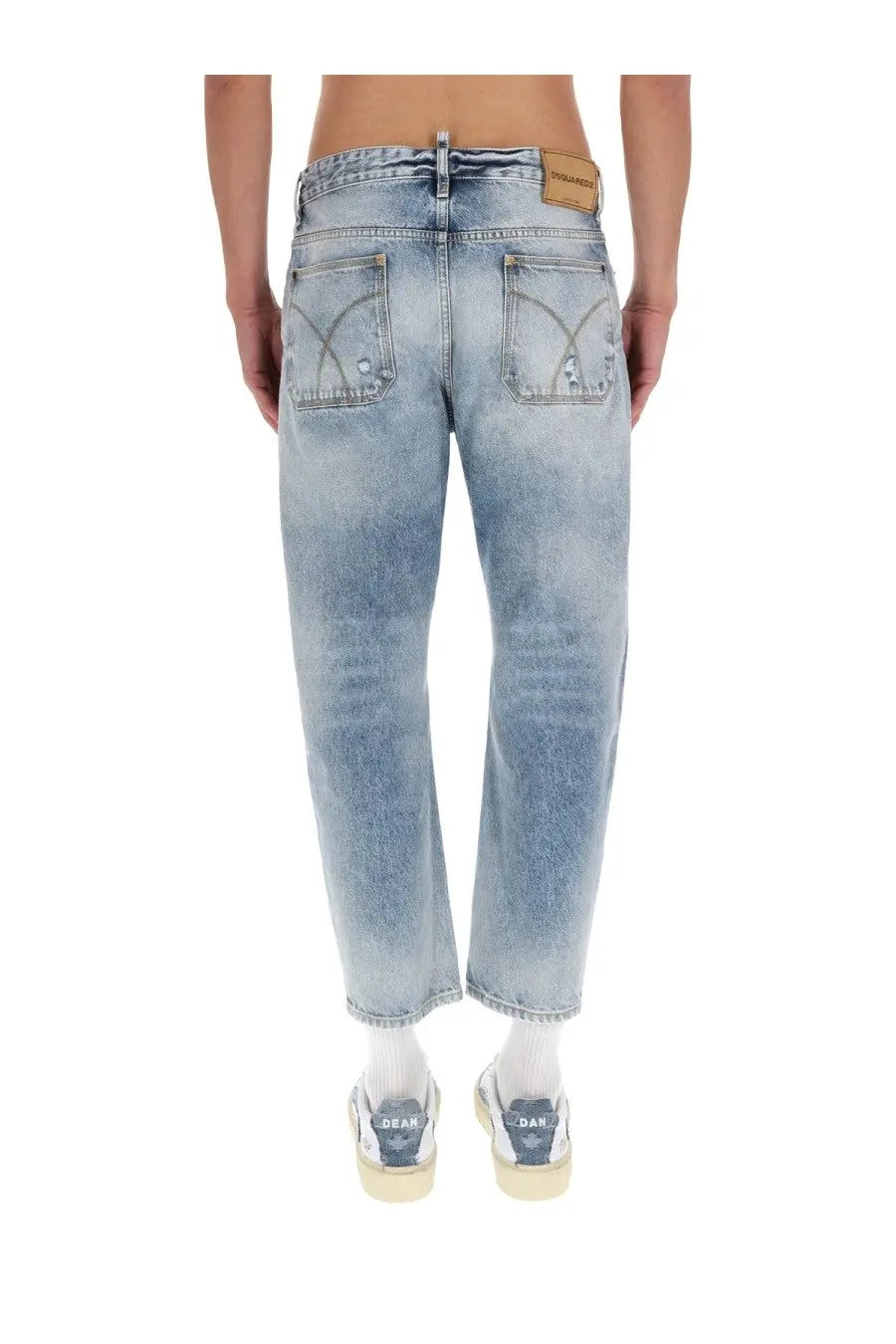 Dsquared2 men’s light-wash blue cotton denim jeans with a faded distressed look and subtle stitching details
