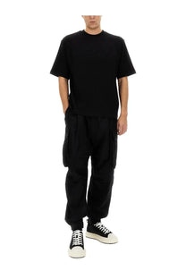 Black short-sleeved crew neck t-shirt with relaxed fit complementing dsquared2 men’s icon new generation cargo pants black