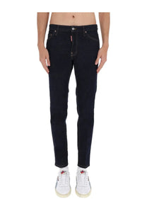 Dark blue slim fit denim jeans with white stitching and dsquared2 logo tag on the waistband for men