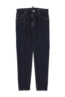 Dark indigo slim fit denim jeans with white stitching and dsquared2 logo tag on the waistband teddy blue model