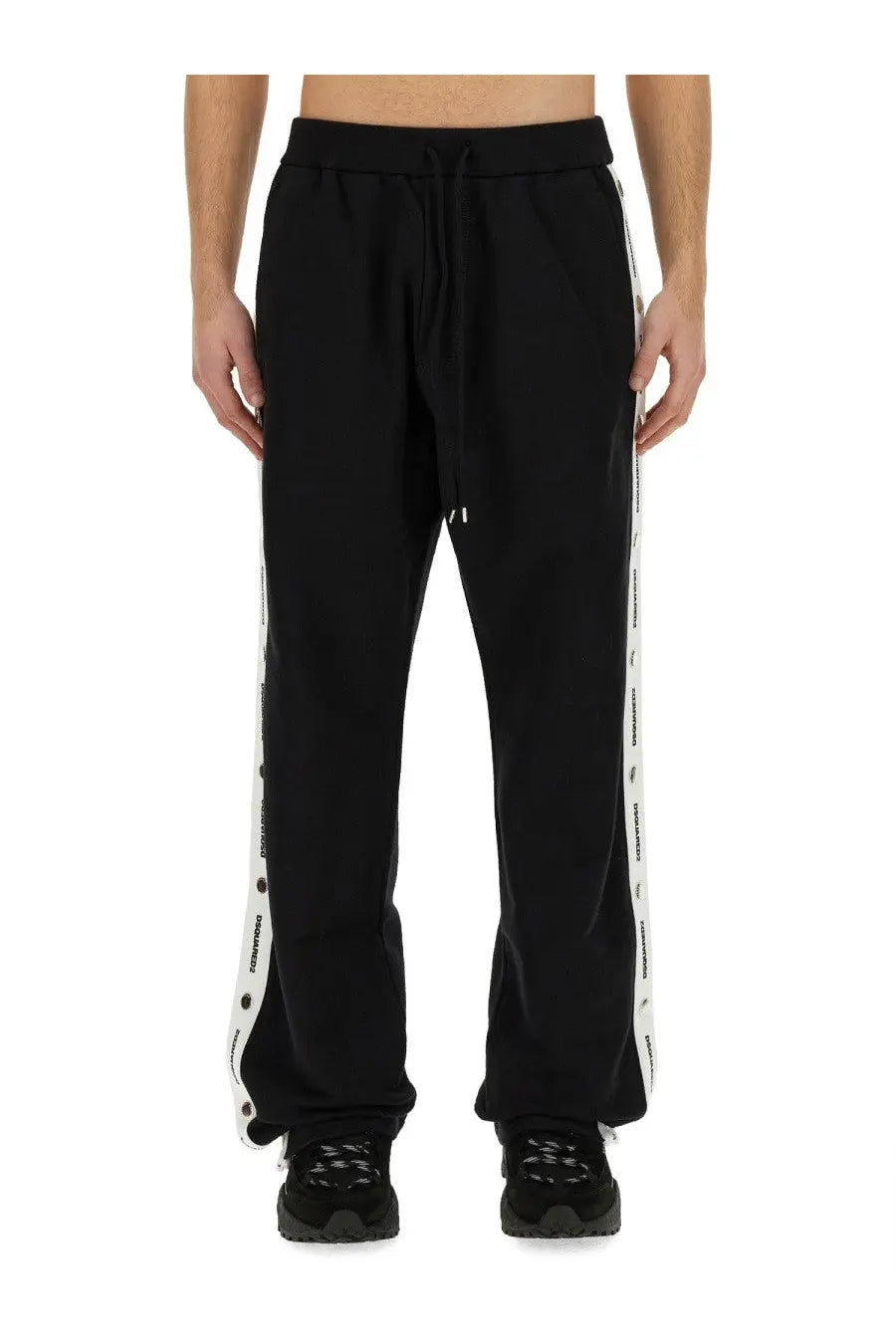 Dsquared2 men’s black jogging pants featuring white side stripes with repeated brand logo for casual wear
