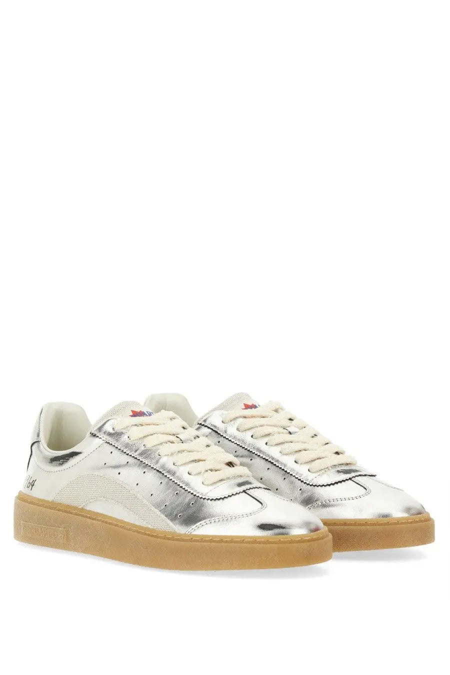 Silver metallic sneakers with a gum rubber sole and cream-colored laces.