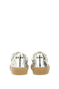 Back view of dsquared2 men’s silver leather sneakers with tan rubber sole and black lettering on the heel