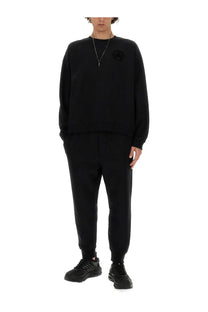Dsquared2 men’s black oversized crewneck sweatshirt with subtle embroidered logo for a relaxed fit look