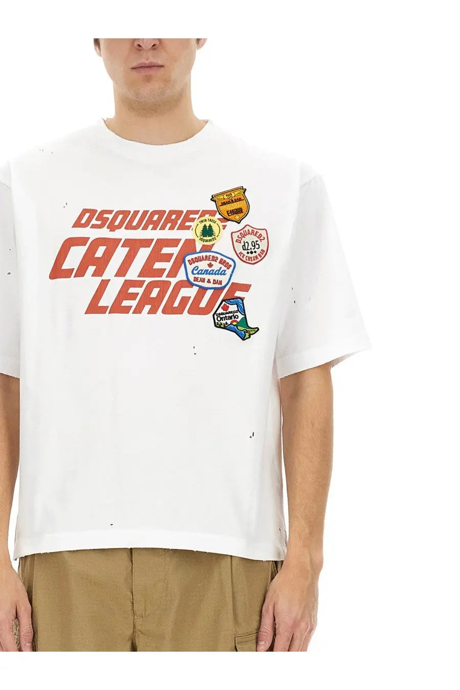 White dsquared2 men’s t-shirt with bold orange caten league graphic, colorful patches, and distressed details