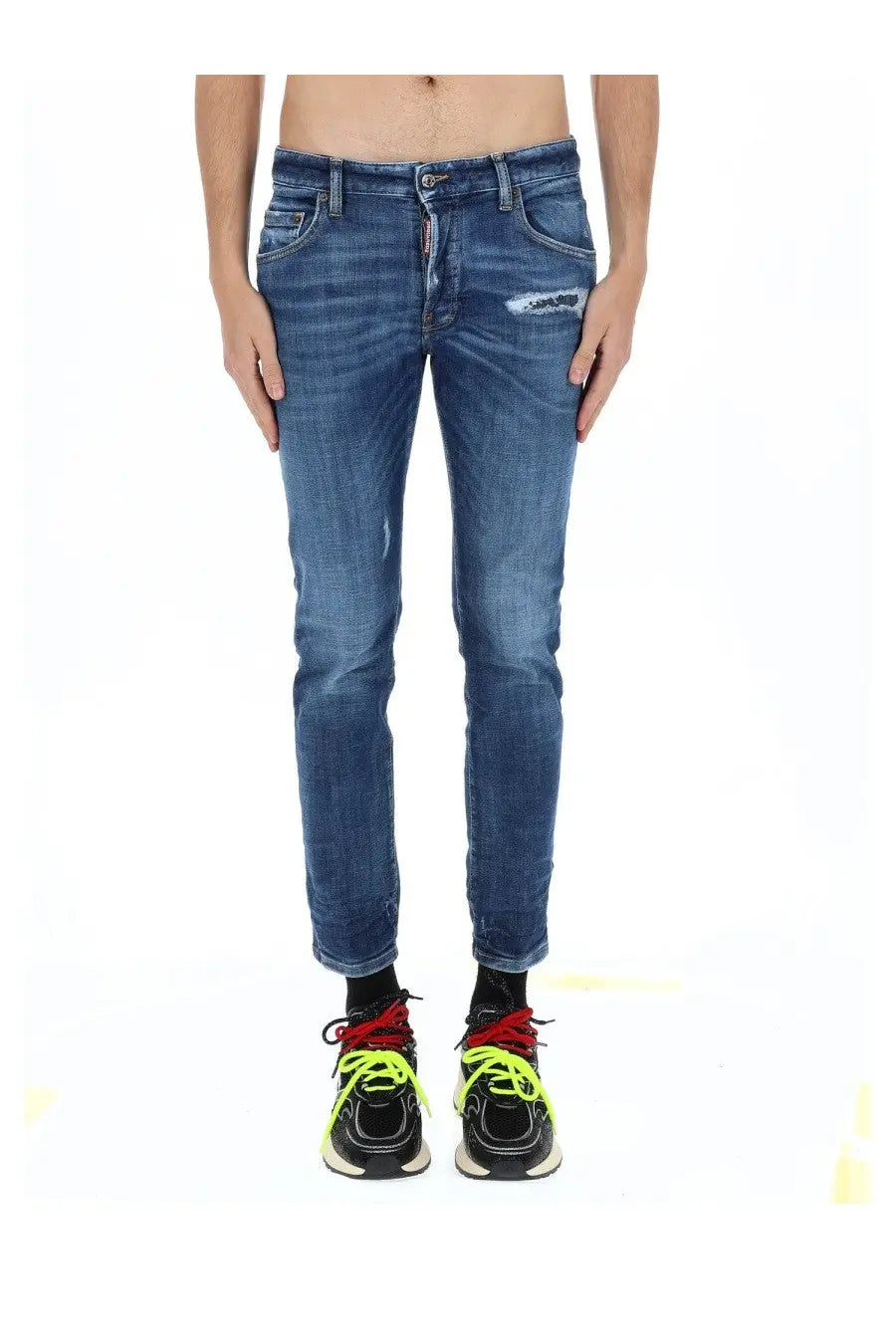 Dsquared2 men’s skater blue denim jeans with a distressed patch on the thigh and visible brand tag at the waistband