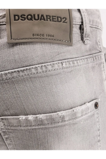 Light gray distressed denim Dsquared2 men’s skater jeans showing back with brand label and casual style