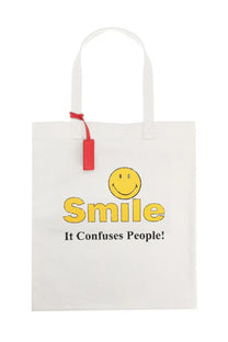Dsquared2 men’s white canvas tote bag with yellow smiley face and smile it confuses people text and red handle tag