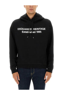 Dsquared2 men’s sweatshirt black featuring a black heritage hoodie with white lettering and white drawstrings