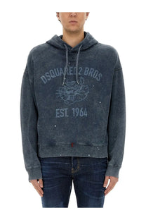 Dark gray distressed Dsquared2 men’s hoodie with faded tiger logo and est design in a blue sweatshirt style