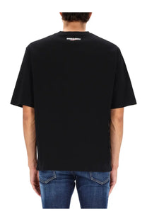 Back view of black dsquared2 men’s vaquera print t-shirt with short sleeves crew neck and white logo at collar