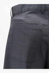 Dark gray wool blend trousers with subtle herringbone weave and structured back pocket shown from the back side