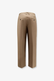 Beige dunst men’s pleated chino slacks trousers with a clean straight-leg cut and subtle back pleats shown from the back