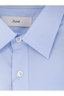 Dunst men’s unisex cotton shirt blue featuring a light blue button-down design with a crisp collar and white buttons