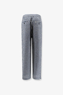 Dunst men’s unisex pyjamas trousers blue featuring black and white checkered wide-leg design with drawstring waistband