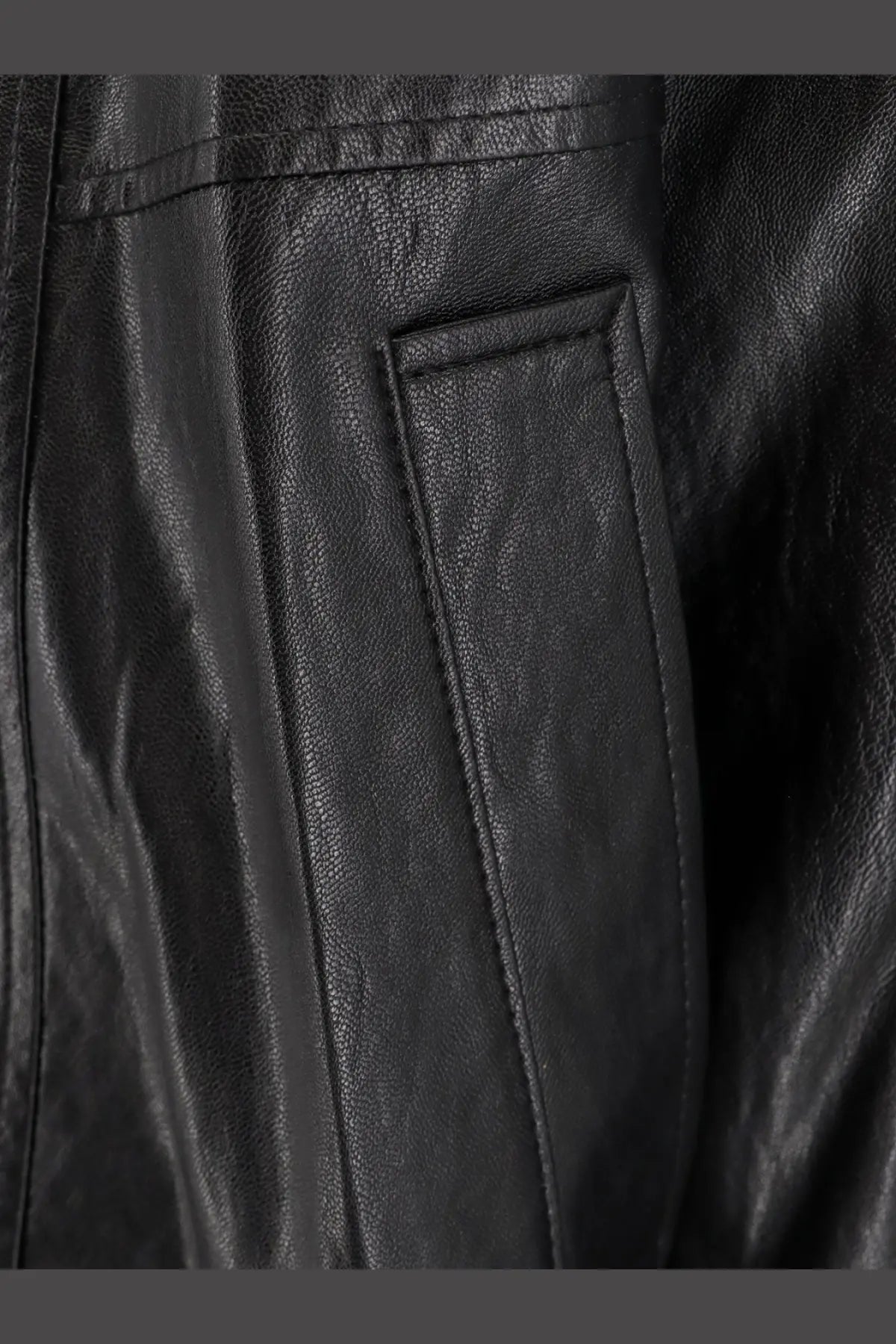 DUNST unisex vegan leather jacket black with textured pebbled surface and precise stitching along the seam