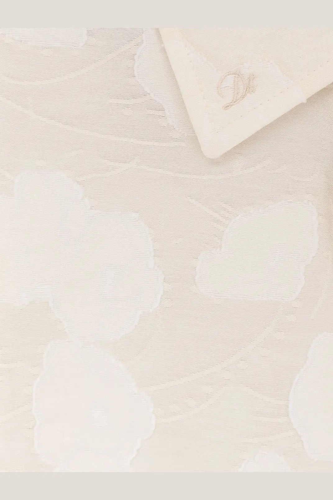 Dunst women’s holiday unisex shirt white featuring cream-colored textured fabric with subtle floral pattern