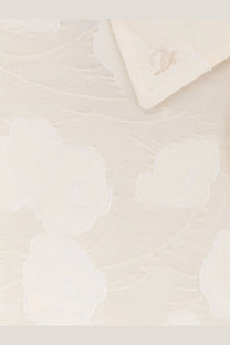 Dunst women’s holiday unisex shirt white featuring cream-colored textured fabric with subtle floral pattern
