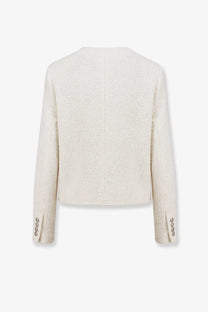Cream-colored dunst women’s unisex bouclé tweed blazer with textured shimmer and three silver buttons on each sleeve cuff