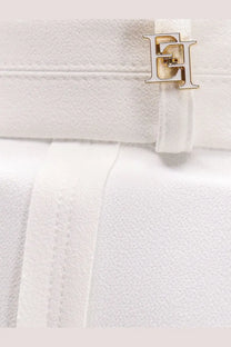 White leather handbag with gold-tone metallic logo clasp paired with elisabetta franchi womens celana daily trousers white