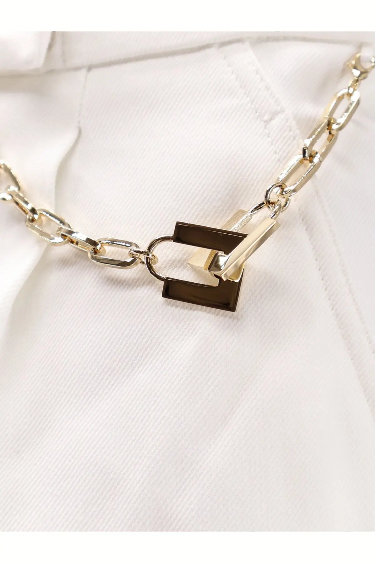 Elisabetta franchi women’s white daily shorts paired with a gold-toned chain necklace featuring a rectangular lock pendant