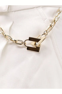 Elisabetta franchi women’s white daily shorts paired with a gold-toned chain necklace featuring a rectangular lock pendant