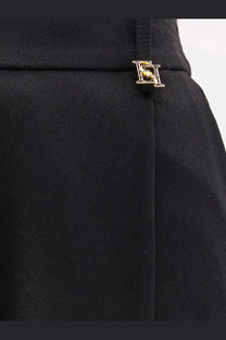 Black high-waisted skirt with gold-tone metallic logo pin at waistband from elisabetta franchi women’s essentials stretch trousers