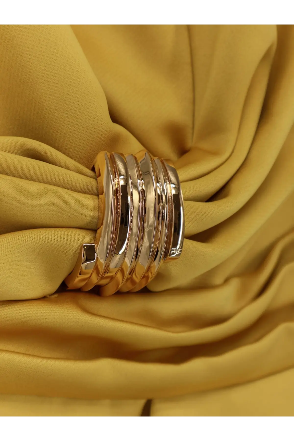 A multi-layered gold-toned metal bangle complementing elisabetta franchi women’s events satin mini dress yellow