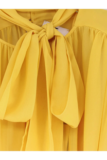 Elisabetta Franchi women’s yellow silk blouse with lightweight fabric and flowing tied bow at the neckline