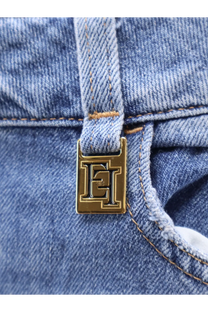 Gold-tone rectangular metal clasp with embossed et logo on light blue cotton denim elisabetta franchi urban jeans