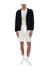 Black emporio armani hooded jacket with sleek modern design paired with emporio armani men’s white cotone shorts