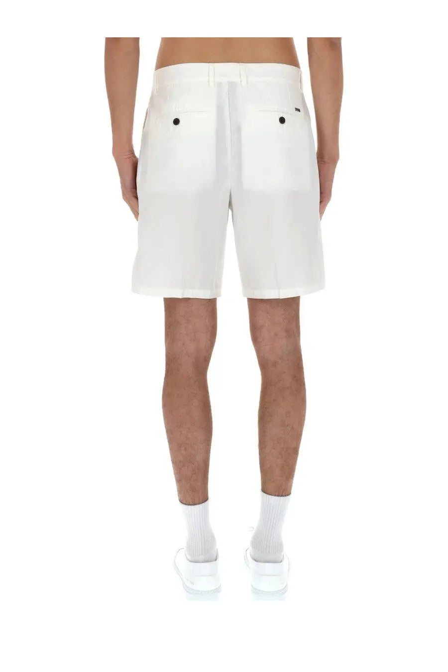 Back view of emporio armani men’s white cotton shorts with black button details on back pockets