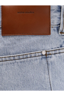 Light-wash cotton denim jeans with brown leather entire studios patch on the back for men in blue