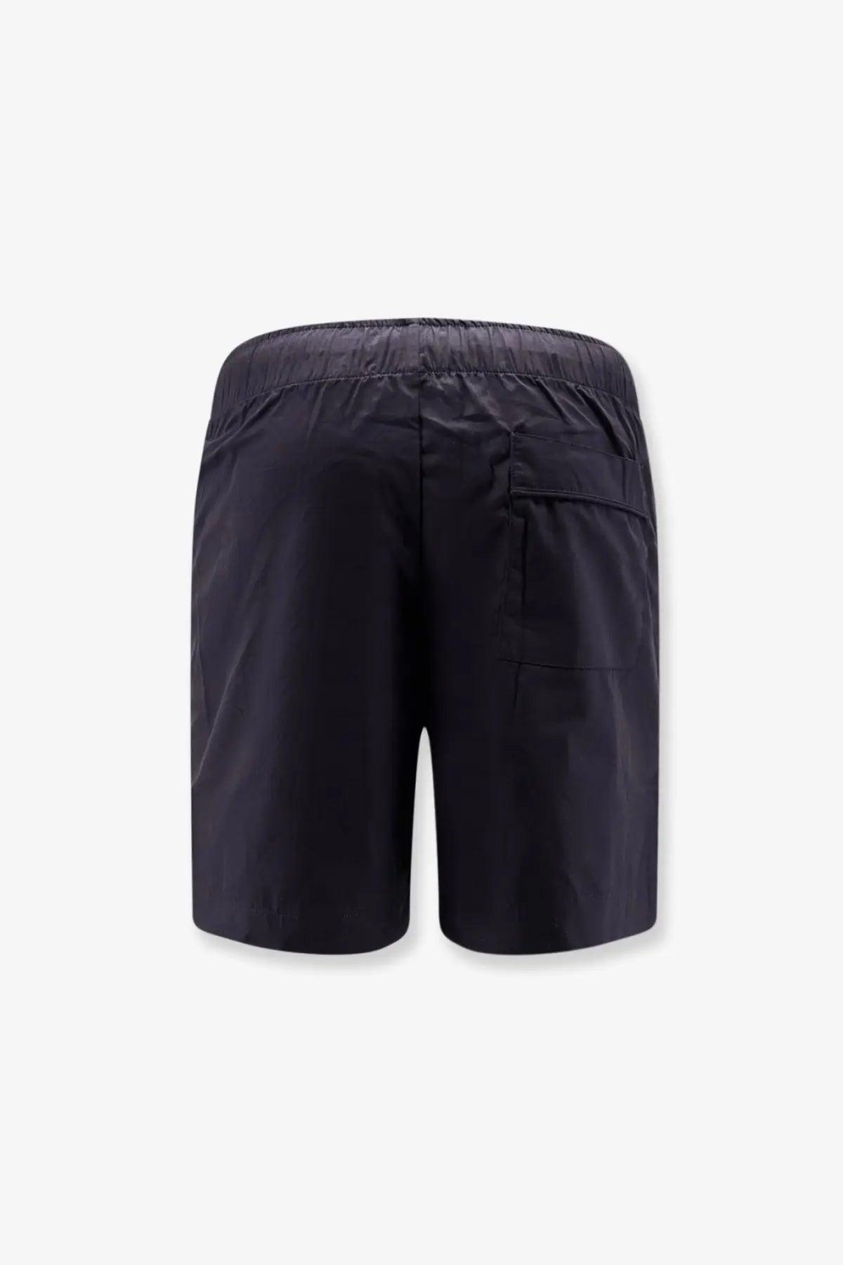 Black cotton bermuda shorts by entire studios shown from the back with an elastic waistband and single rear pocket