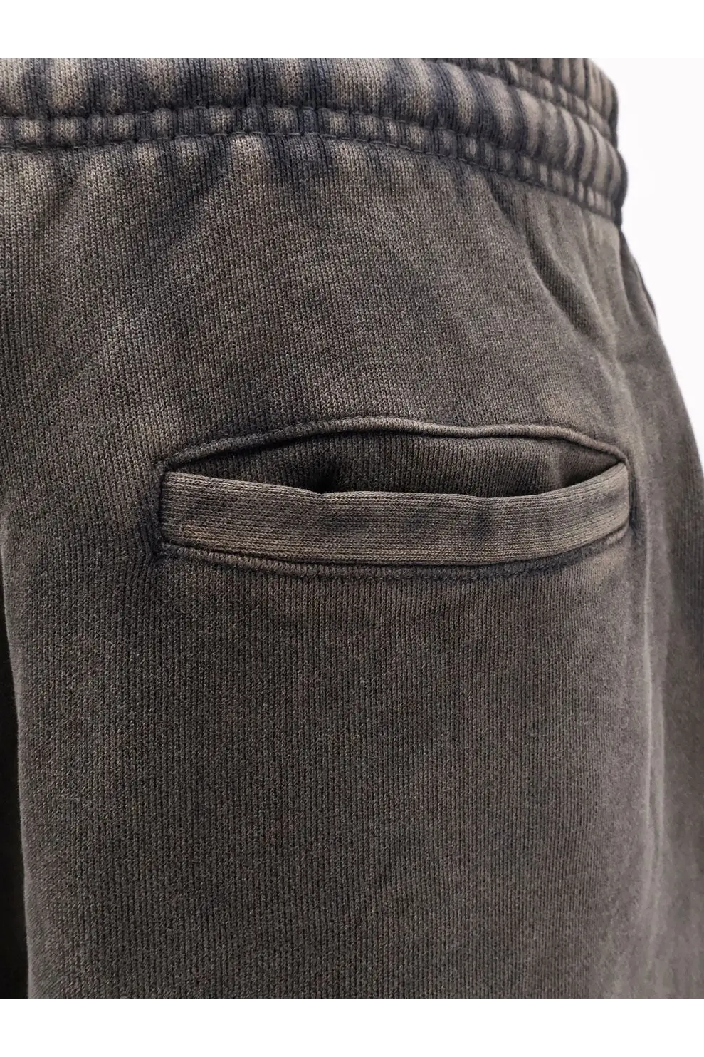 Entire studios unisex black cotton jogging trousers featuring dark gray soft-knit fabric with ribbed waistband and front pocket