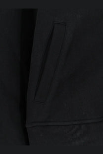 Black ribbed fabric pocket with neat stitching on Entire Studios unisex eternal zip cotton sweatshirt black