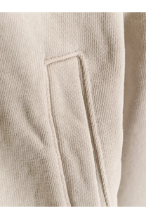 Beige ribbed knit fabric with stitched pocket detail on entire studios unisex eternal zip cotton sweatshirt white