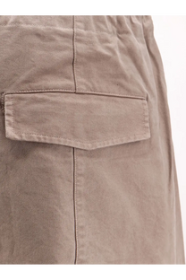Beige cotton cargo pocket with neat stitching and subtle texture on entire studios unisex loft cotton trousers clay