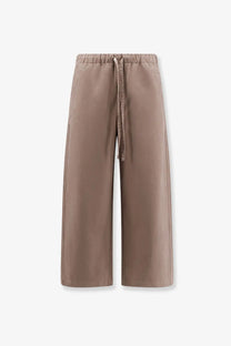 Beige cotton wide-leg trousers with elastic waistband and drawstring from entire studios unisex loft collection clay