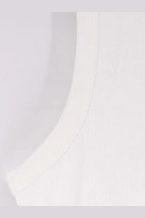 White ribbed cotton tank top with curved neckline by Entire Studios for unisex comfortable wear