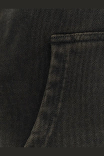 Entire studios unisex standard hood cotton sweatshirt black showing black ribbed knit fabric with stitched pocket detail