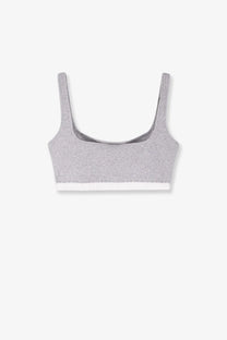 Entire studios women’s cotton blend gray heathered sports bra with white trim along the bottom edge pebble