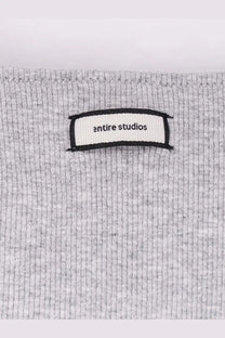 Gray ribbed knit cotton blend sweater with entire studios label in black text on white for women pebble color
