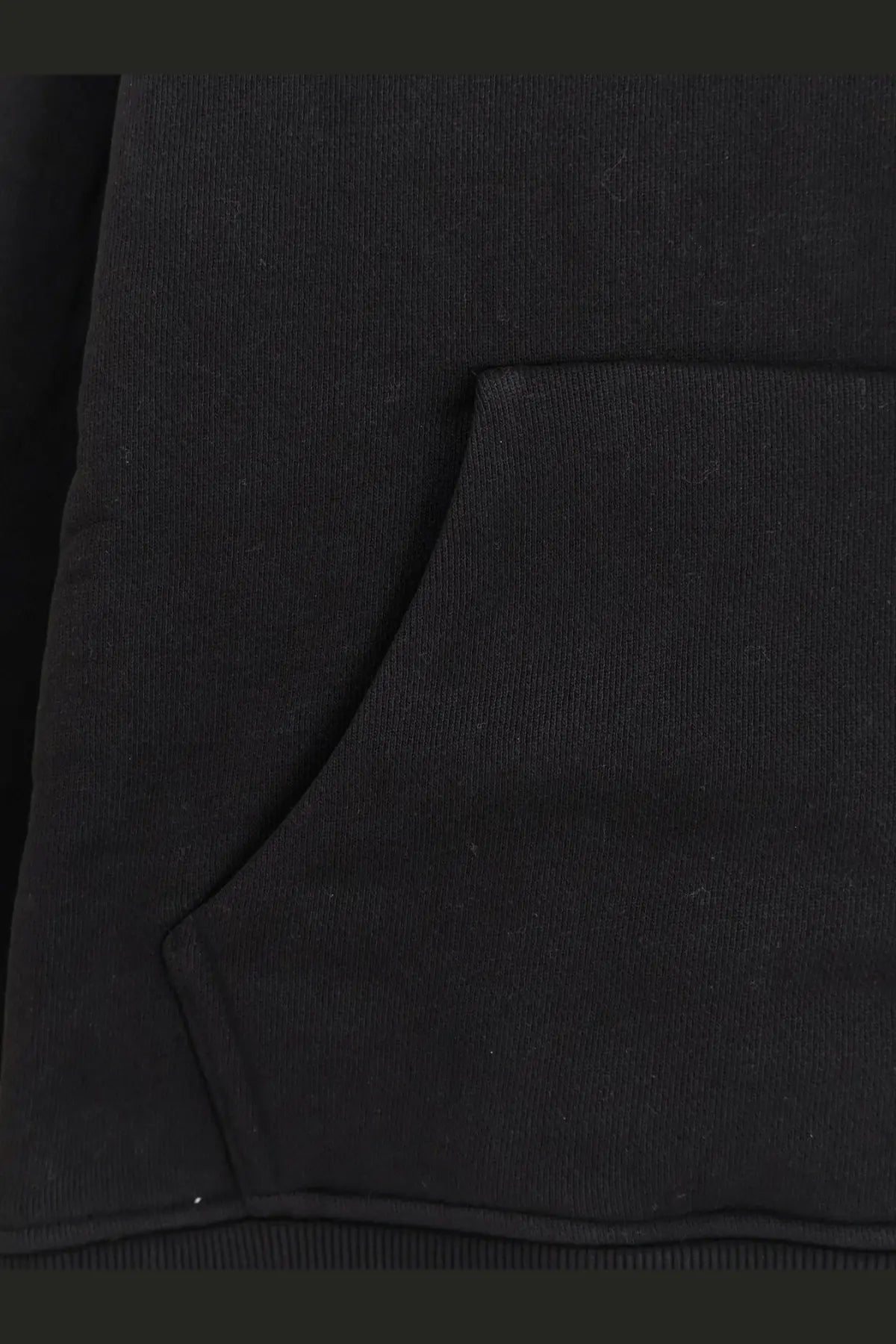Black ribbed knit fabric pocket with subtle texture and clean edges on Entire Studios women’s cotton sweatshirt black