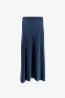 A sleek navy blue satin maxi skirt with high-waisted wrap design and subtle side slits from Eres women’s Julieta collection