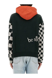 Back view of erl men’s venice sweatshirt black hooded with checkered orange sleeves and white be nice embroidery
